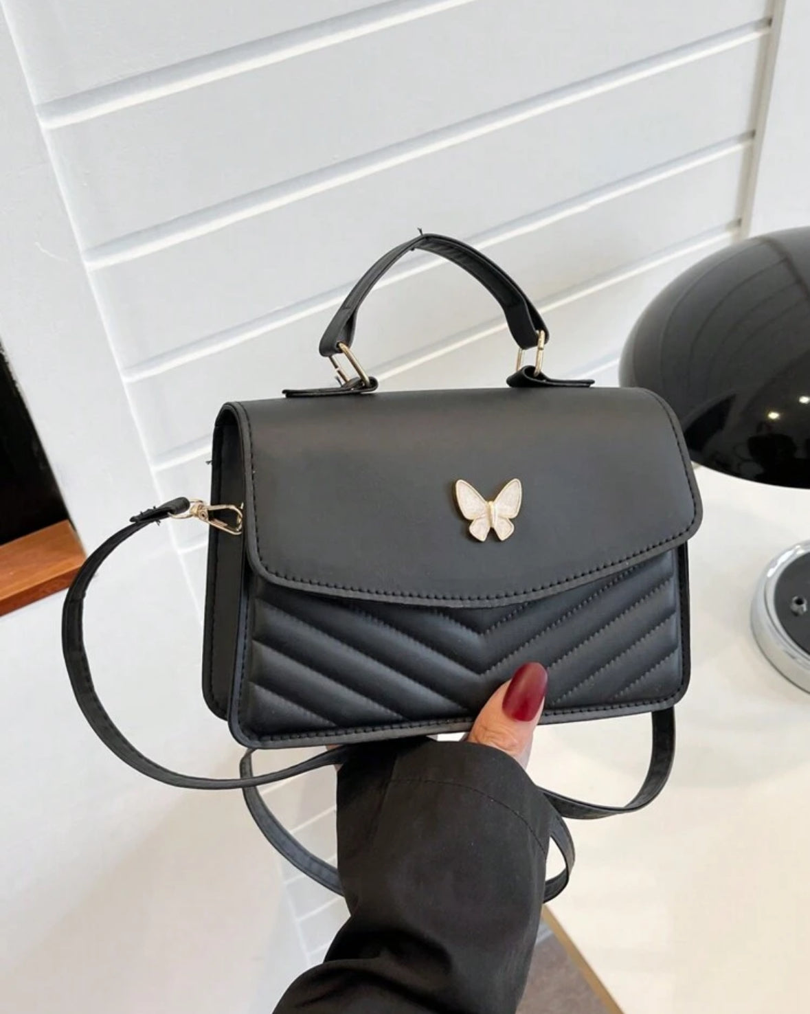 SORTEO CARTERA MARIPOSA NEGRA