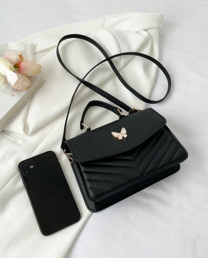SORTEO CARTERA MARIPOSA NEGRA